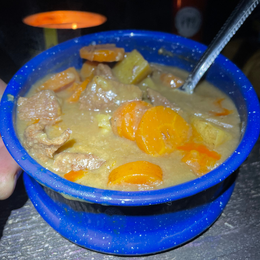 Cowboy Style Beef Stew Cooked Over a Campfire